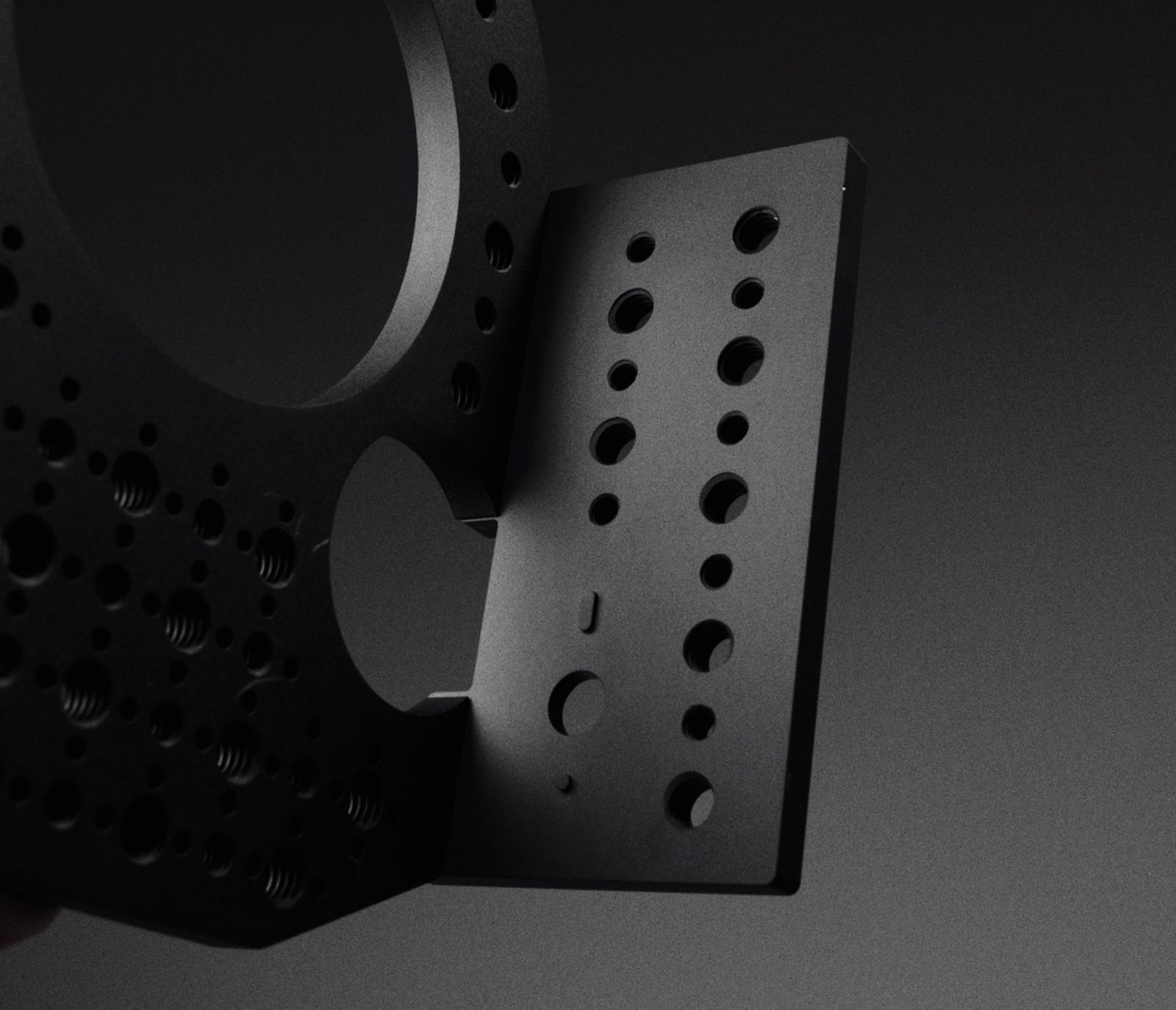 The base plate bolted to the side plate, showing how the two parts meet